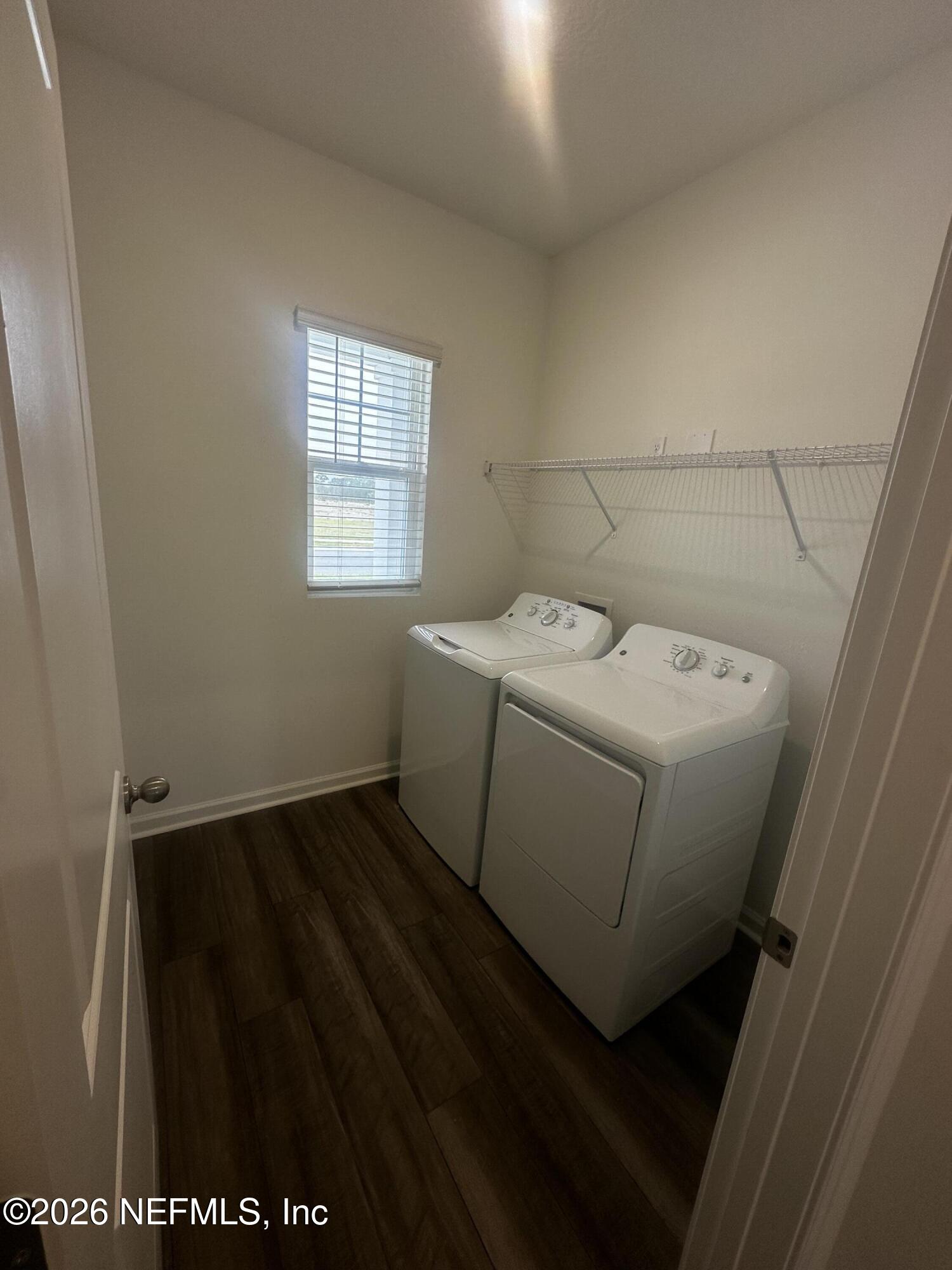 54 Oriole Road Palm Coast, FL 32137 - Photo 8 of 23 a utility room with dryer and washer