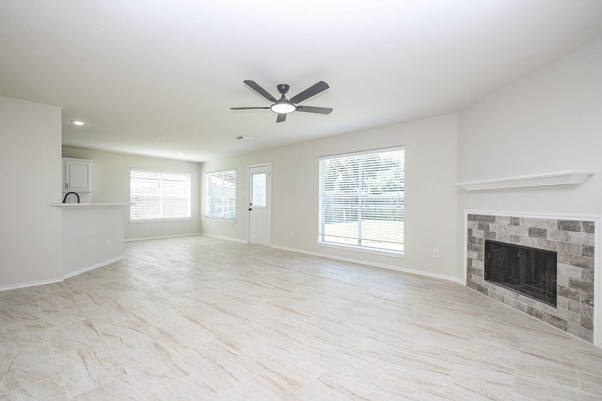 4810 Arbor Court Rosenberg, TX 77471 - Photo 10 of 20 a view of an empty room with a fireplace and a window