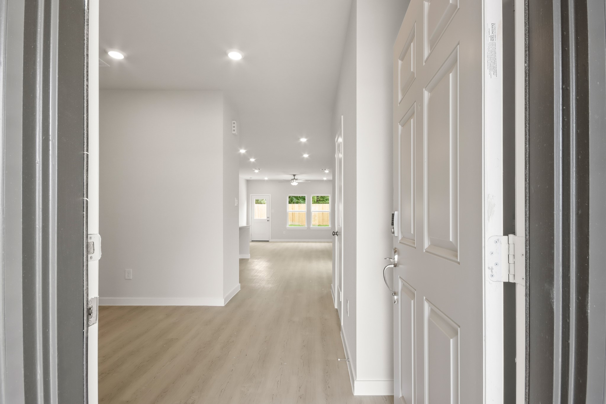 229 Spring Drive Hockley, TX 77447 - Photo 5 of 26 a view of a hallway with wooden floor and closet area
