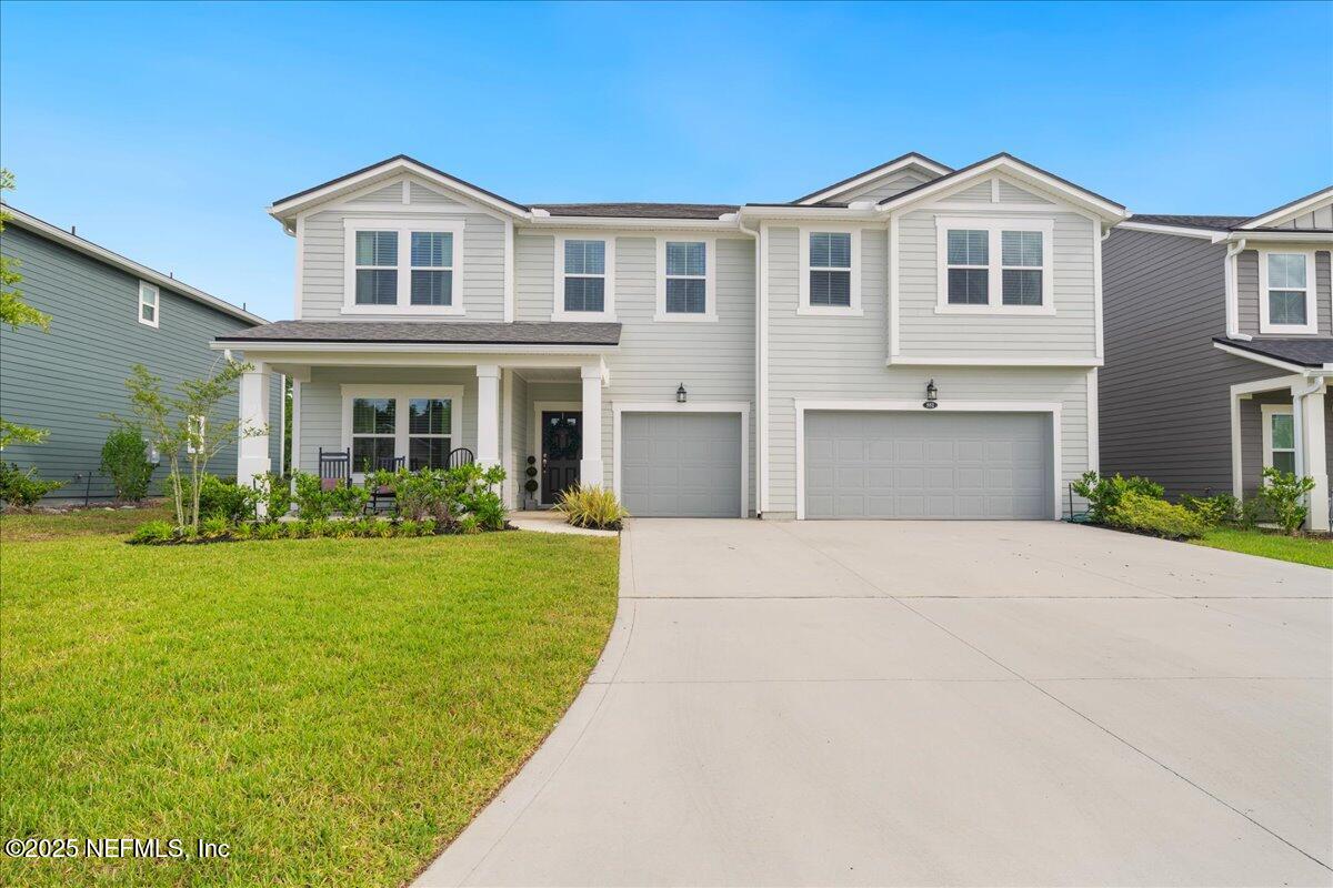 552 Meadow Creek Drive St. Johns, FL 32259 - Photo 1 of 62 a front view of a house with a yard