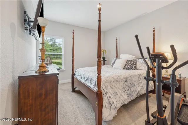 a bathroom with a sink a toilet a large mirror and shower