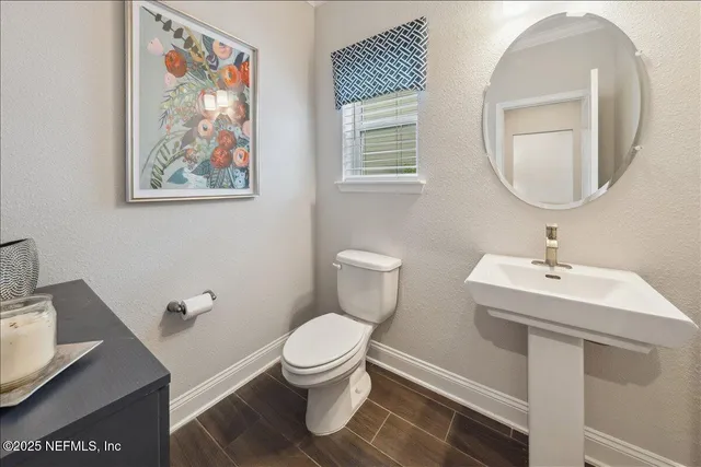 a spacious bathroom with a shower sink and mirror