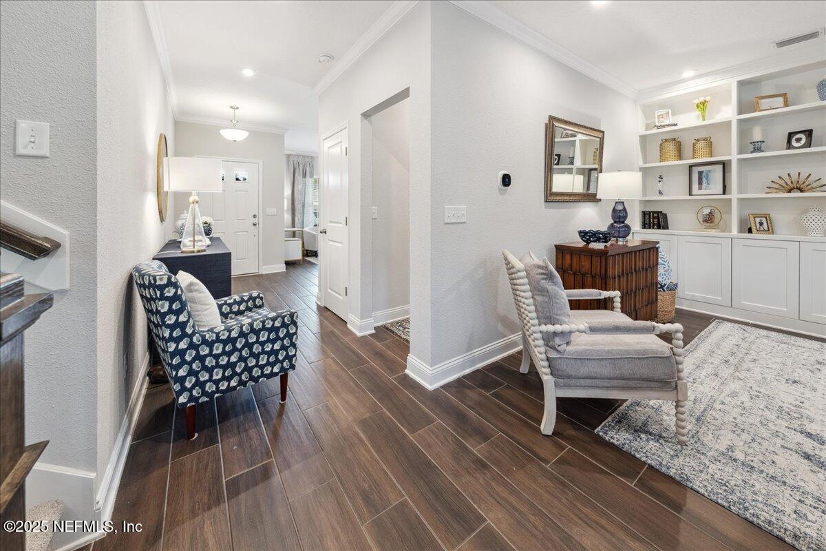 552 Meadow Creek Drive St. Johns, FL 32259 - Photo 3 of 62 a living room with furniture and a wooden floor