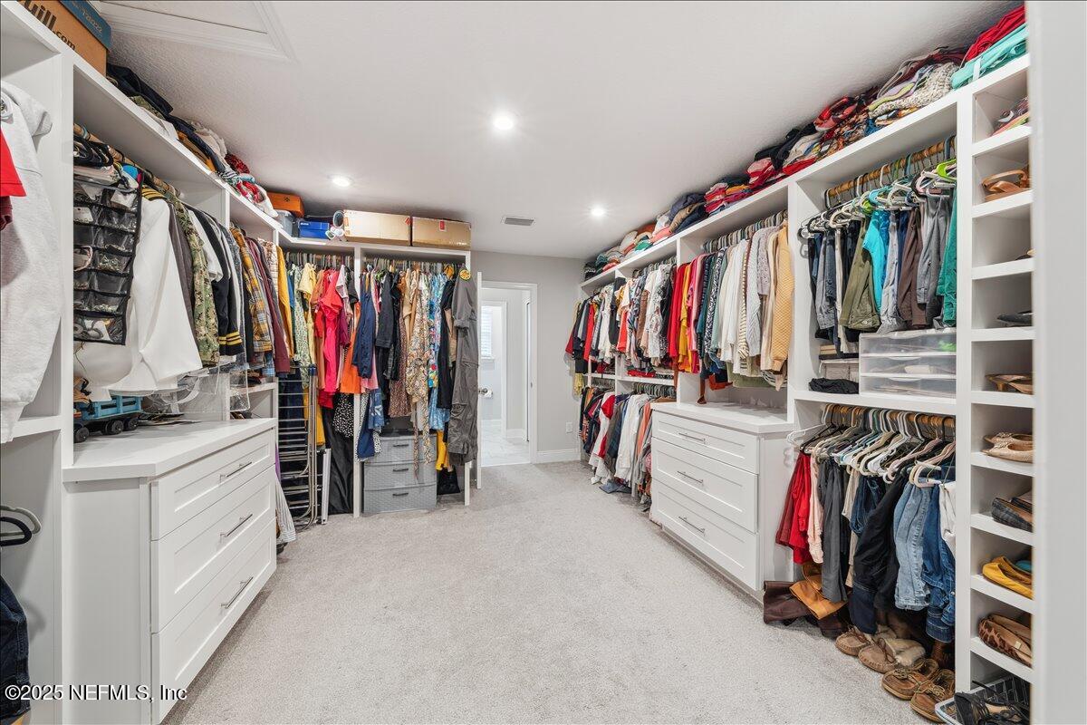 552 Meadow Creek Drive St. Johns, FL 32259 - Photo 32 of 62 a view of walk in closet with clothes