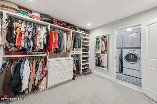 a view of a lake with table and chairs