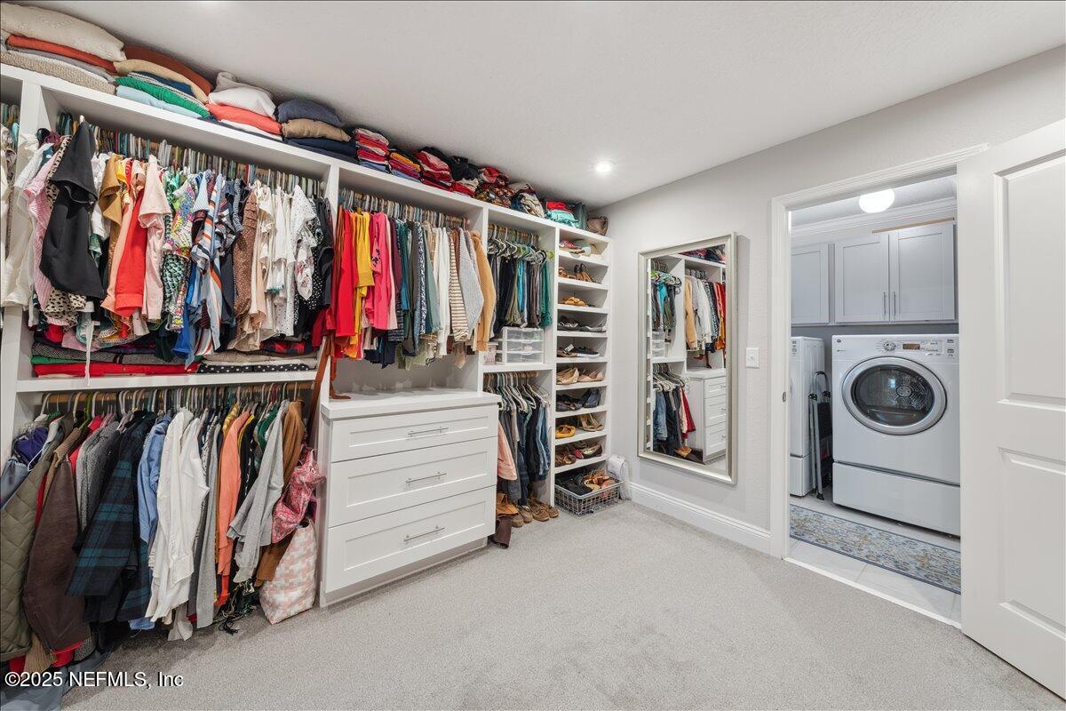 552 Meadow Creek Drive St. Johns, FL 32259 - Photo 33 of 62 a view of walk in closet with clothes and shoes