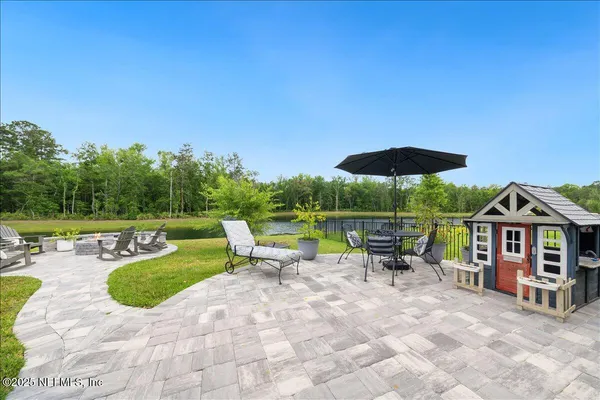 an aerial view of residential houses and outdoor space