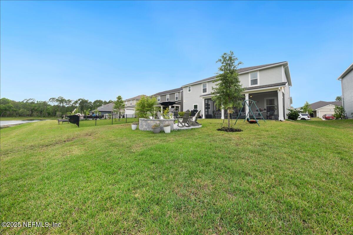 552 Meadow Creek Drive St. Johns, FL 32259 - Photo 40 of 62 a view of a house with a big yard