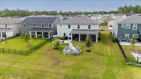 a view of a swimming pool with an outdoor seating