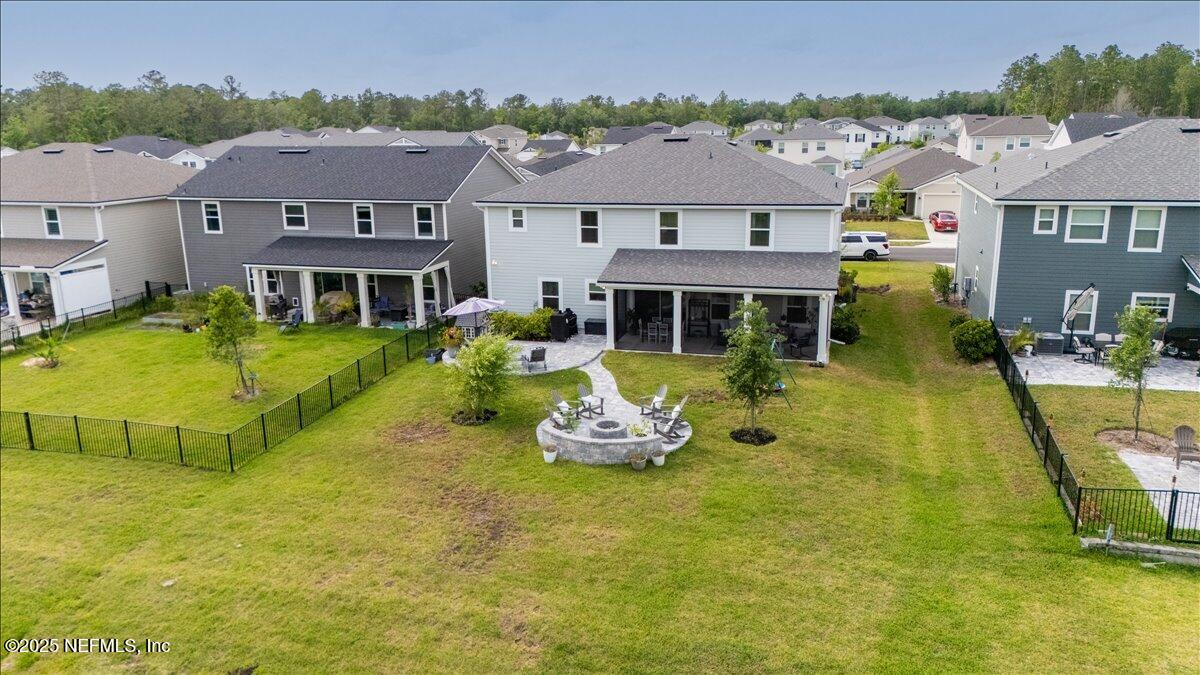 552 Meadow Creek Drive St. Johns, FL 32259 - Photo 41 of 62 an aerial view of a house with swimming pool and a yard