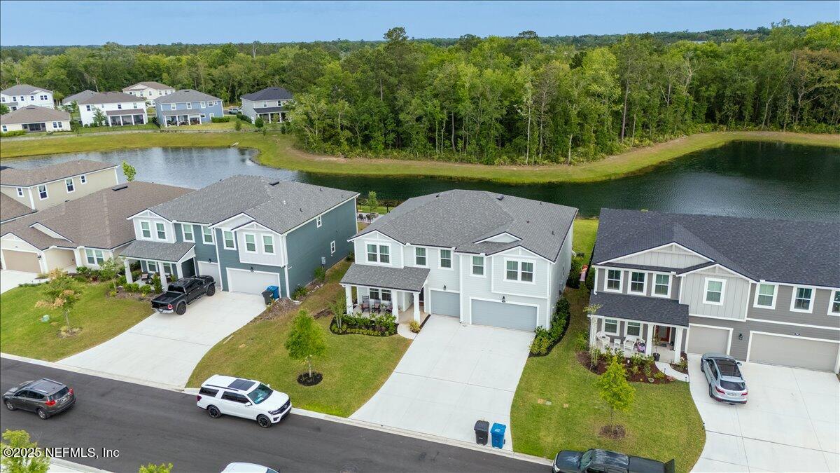 552 Meadow Creek Drive St. Johns, FL 32259 - Photo 42 of 62 an aerial view of a house with swimming pool patio and outdoor seating