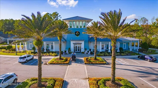 an aerial view of a house with a swimming pool