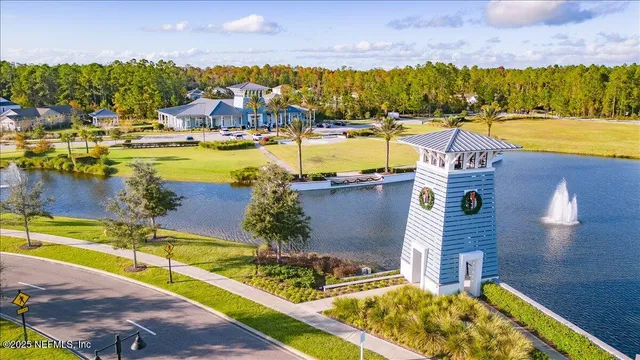 an aerial view of a house with a ocean view