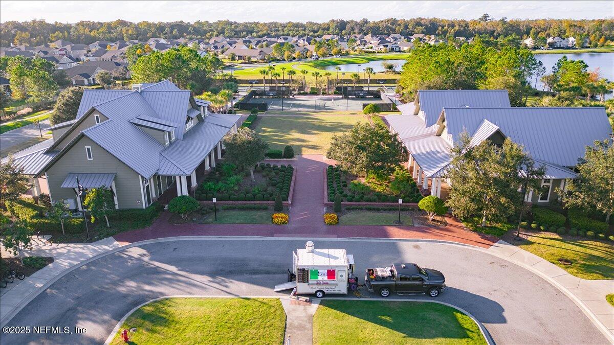 552 Meadow Creek Drive St. Johns, FL 32259 - Photo 51 of 62 an aerial view of a house with a swimming pool yard and outdoor seating