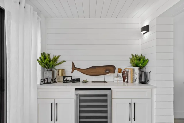 a bathroom with a sink a potted plant and a potted plant