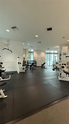 a gym with lots of table and chairs