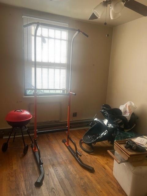 54 Veronica Place, Unit 1B Brooklyn, NY 11226 - Photo 6 of 12 a room with furniture and gym equipment