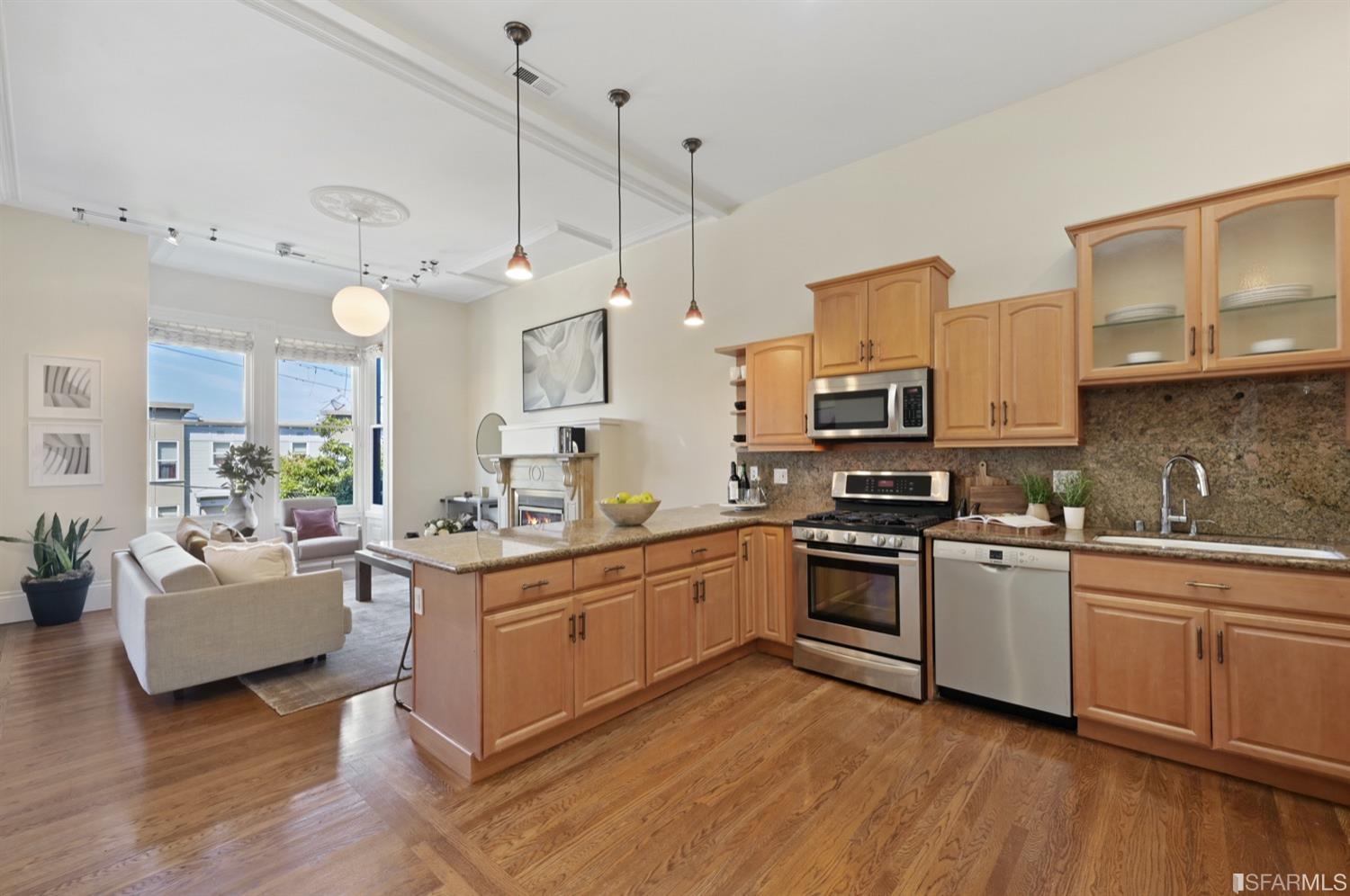 1663 Turk Street San Francisco, CA 94115 - Photo 11 of 27 a kitchen with stainless steel appliances granite countertop a stove a sink dishwasher and a refrigerator with wooden floor
