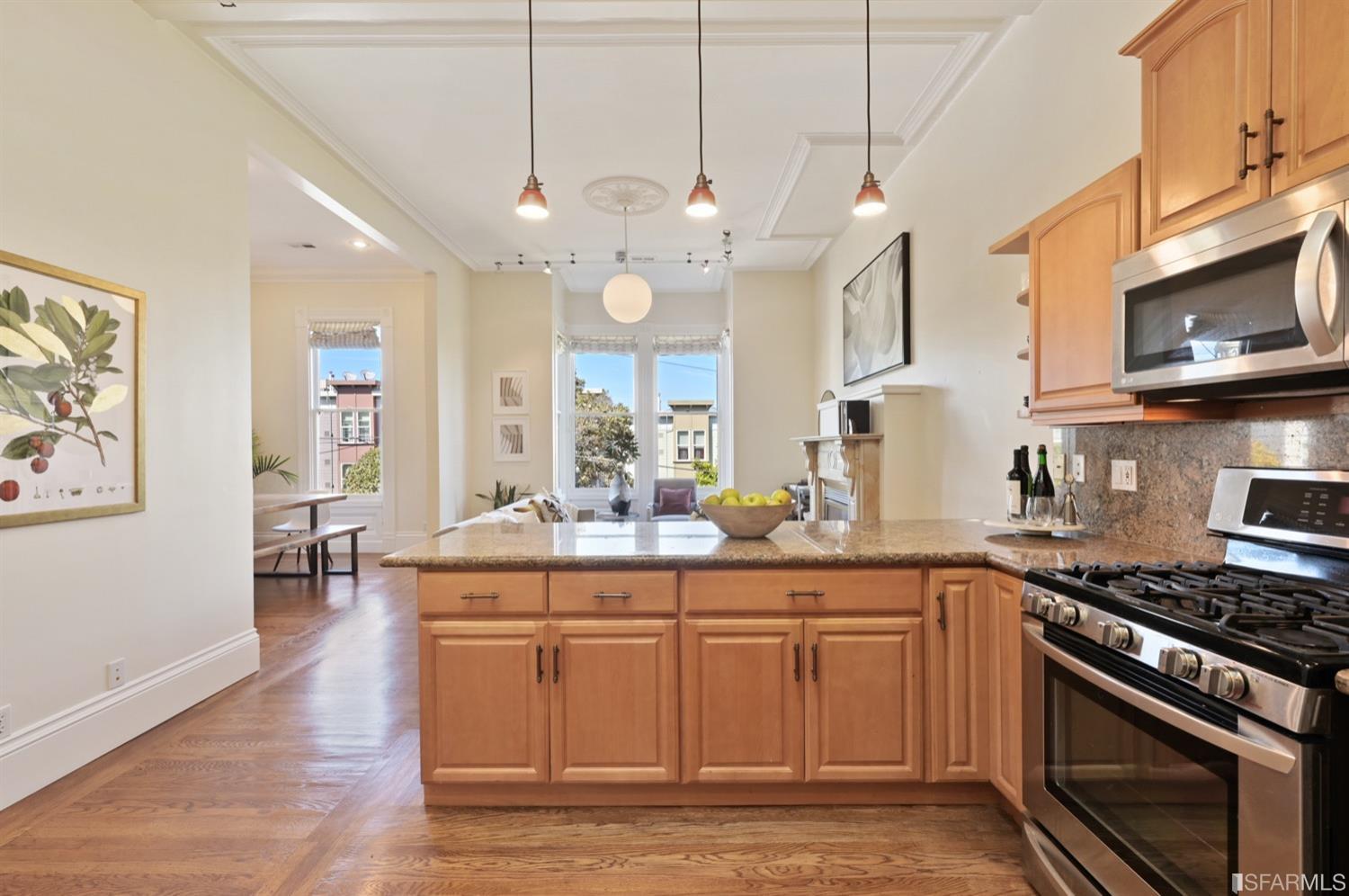 1663 Turk Street San Francisco, CA 94115 - Photo 13 of 27 a kitchen with cabinets and wooden floor