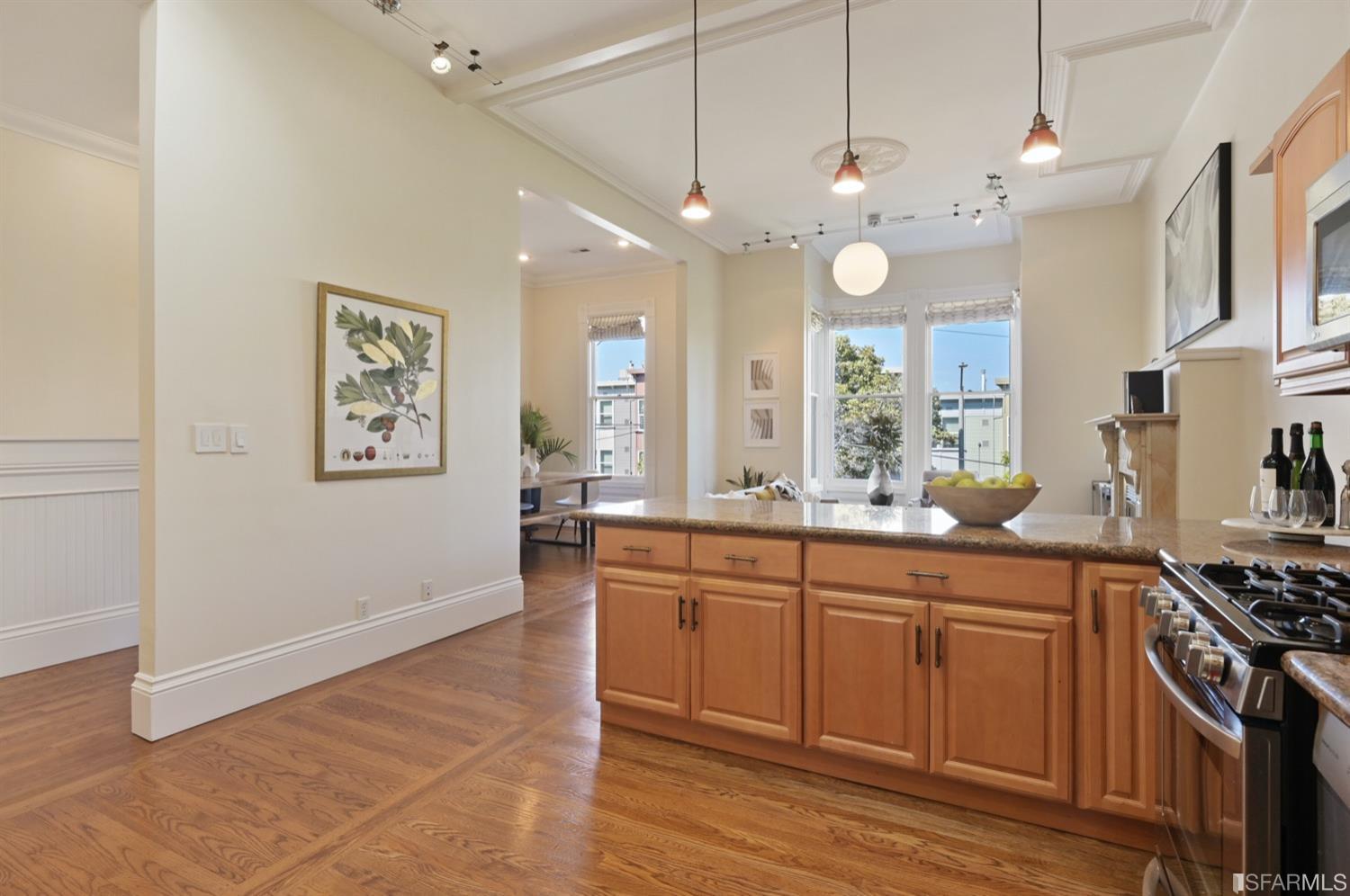 1663 Turk Street San Francisco, CA 94115 - Photo 14 of 27 a large kitchen with granite countertop a stove a sink and a refrigerator