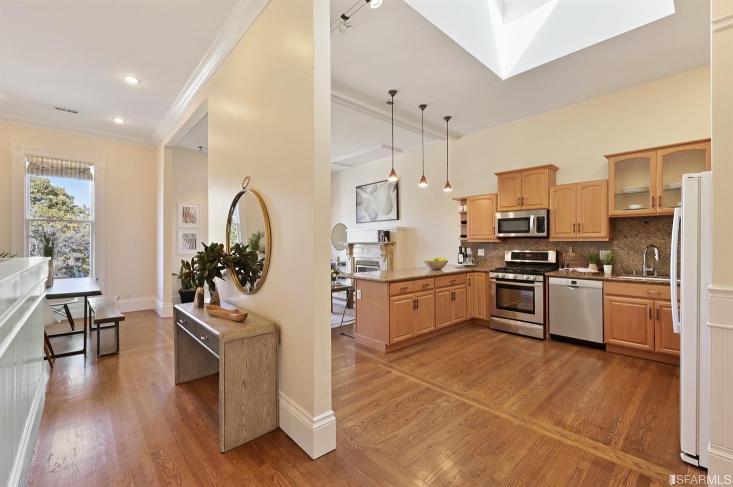 1663 Turk Street San Francisco, CA 94115 - Photo 15 of 27 a kitchen with granite countertop a stove a sink dishwasher a refrigerator and cabinets with wooden floor