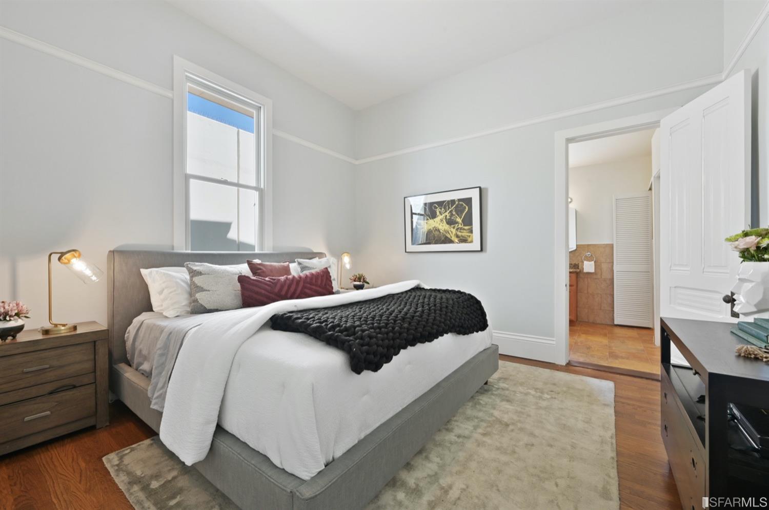 1663 Turk Street San Francisco, CA 94115 - Photo 16 of 27 a bedroom with a bed and a couch