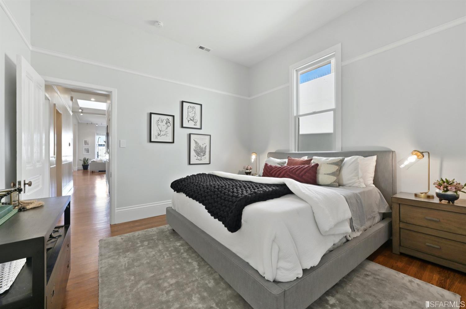 1663 Turk Street San Francisco, CA 94115 - Photo 17 of 27 a bedroom with a bed and a night stand