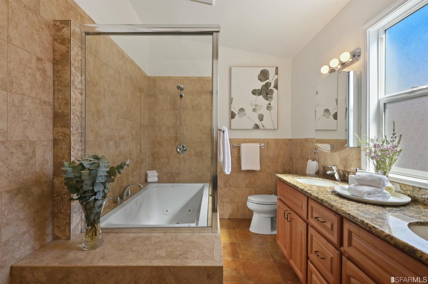 1663 Turk Street San Francisco, CA 94115 - Photo 19 of 27 a bathroom with a granite countertop sink a toilet and shower