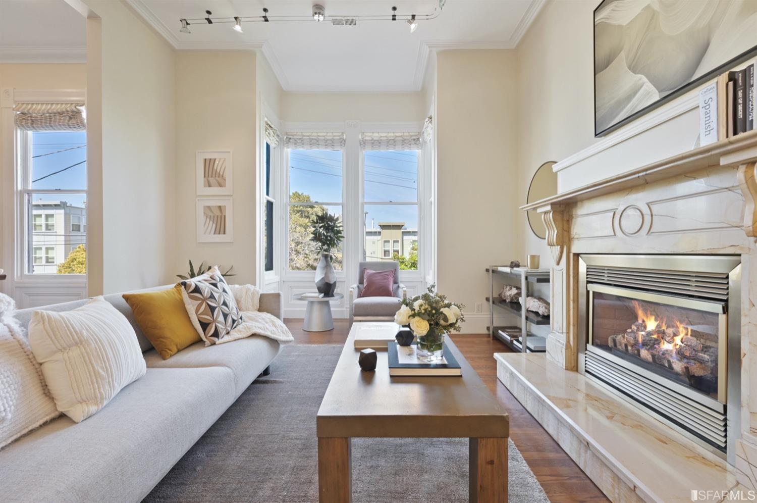 1663 Turk Street San Francisco, CA 94115 - Photo 2 of 27 a living room with furniture and a fireplace