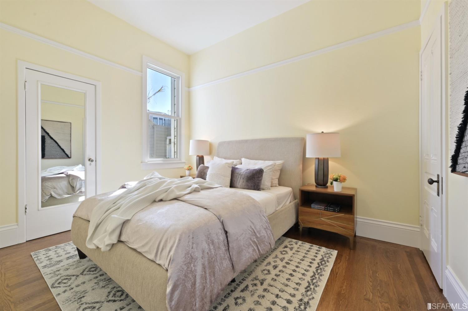 1663 Turk Street San Francisco, CA 94115 - Photo 21 of 27 a bedroom with a bed and a window