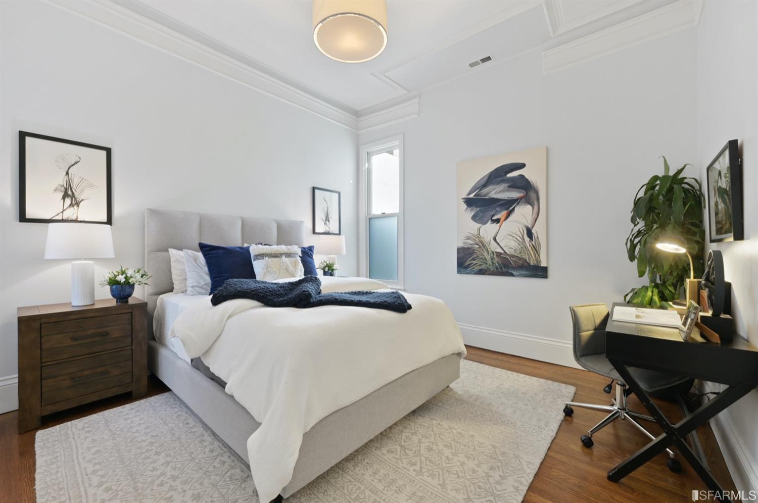 1663 Turk Street San Francisco, CA 94115 - Photo 23 of 27 a bedroom with a large bed and a chair