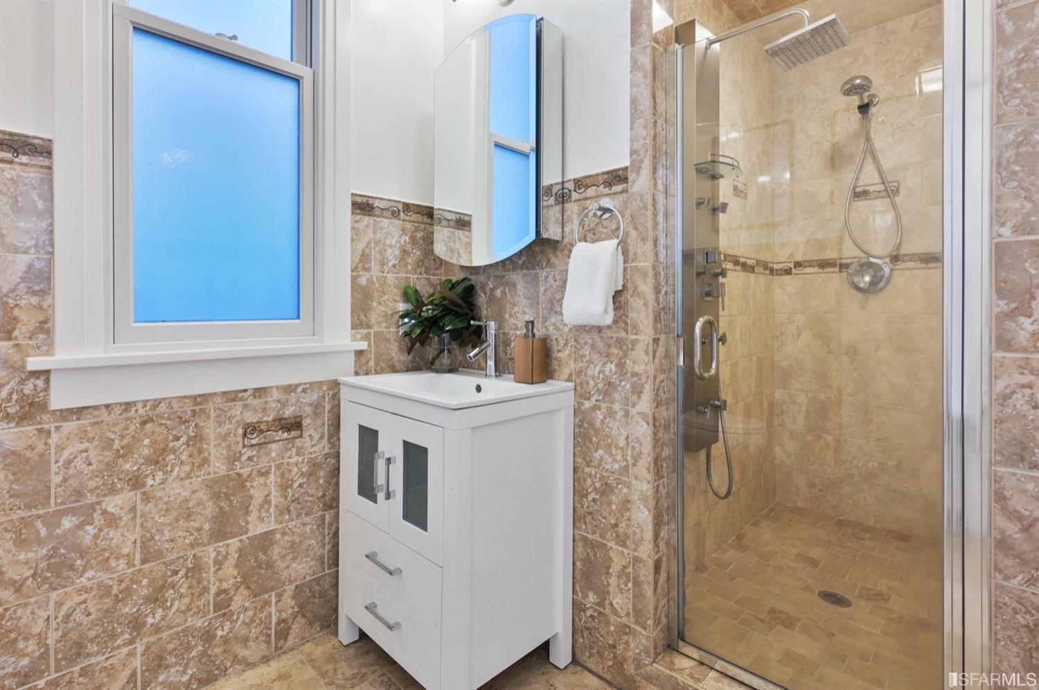 1663 Turk Street San Francisco, CA 94115 - Photo 25 of 27 a bathroom with a shower and a sink