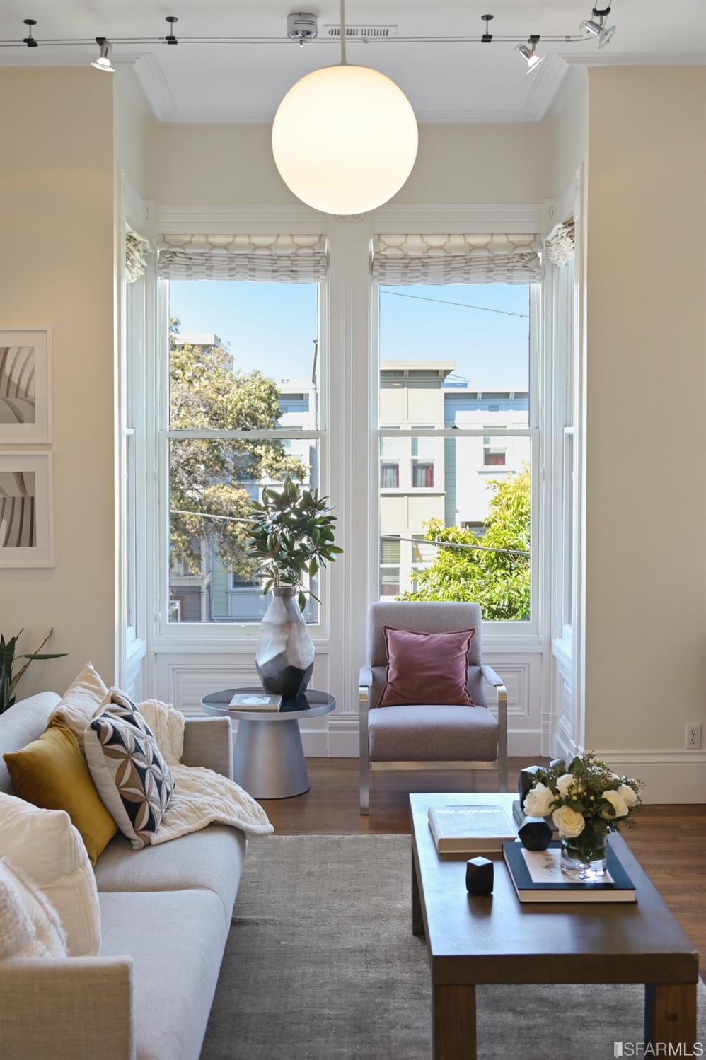 1663 Turk Street San Francisco, CA 94115 - Photo 7 of 27 a living room with furniture and a large window