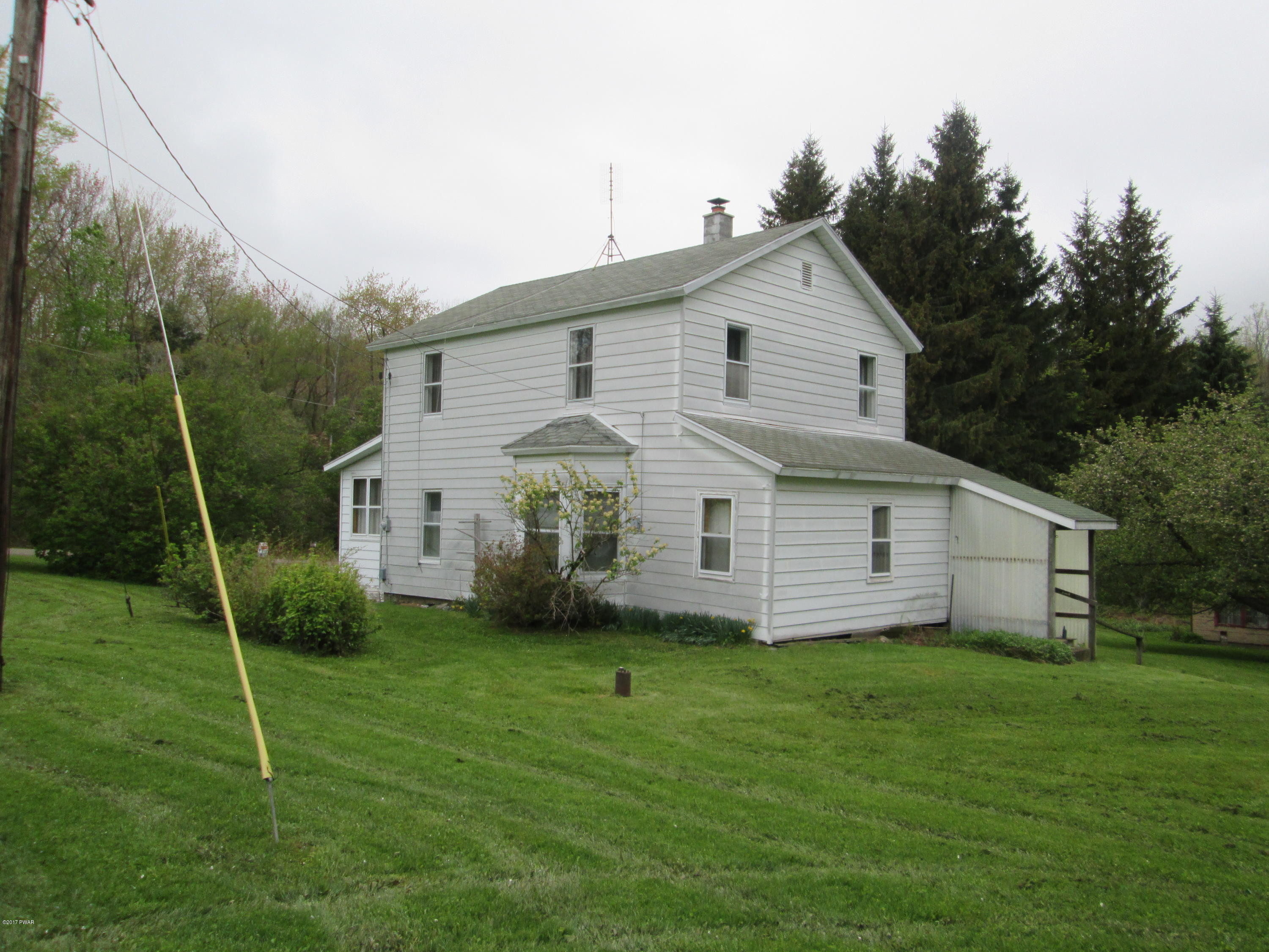 86 Beaver Hollow Road Lakewood, PA 18439 - Photo 25 of 30 a view of a house with backyard and garden