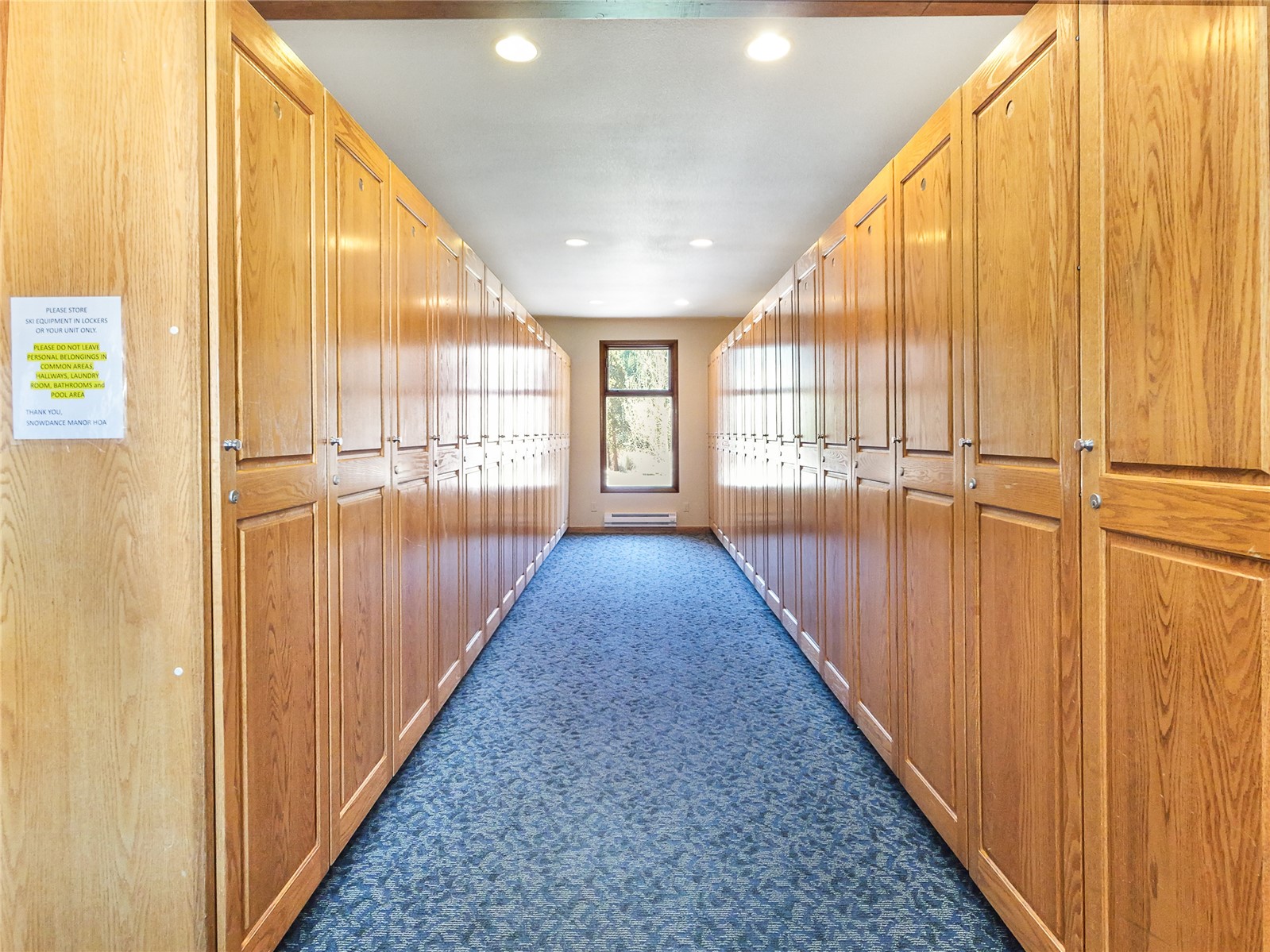 23034 Highway 6, Unit 305 Keystone, CO 80435 - Photo 22 of 27 a view of a hallway with wooden floor and staircase