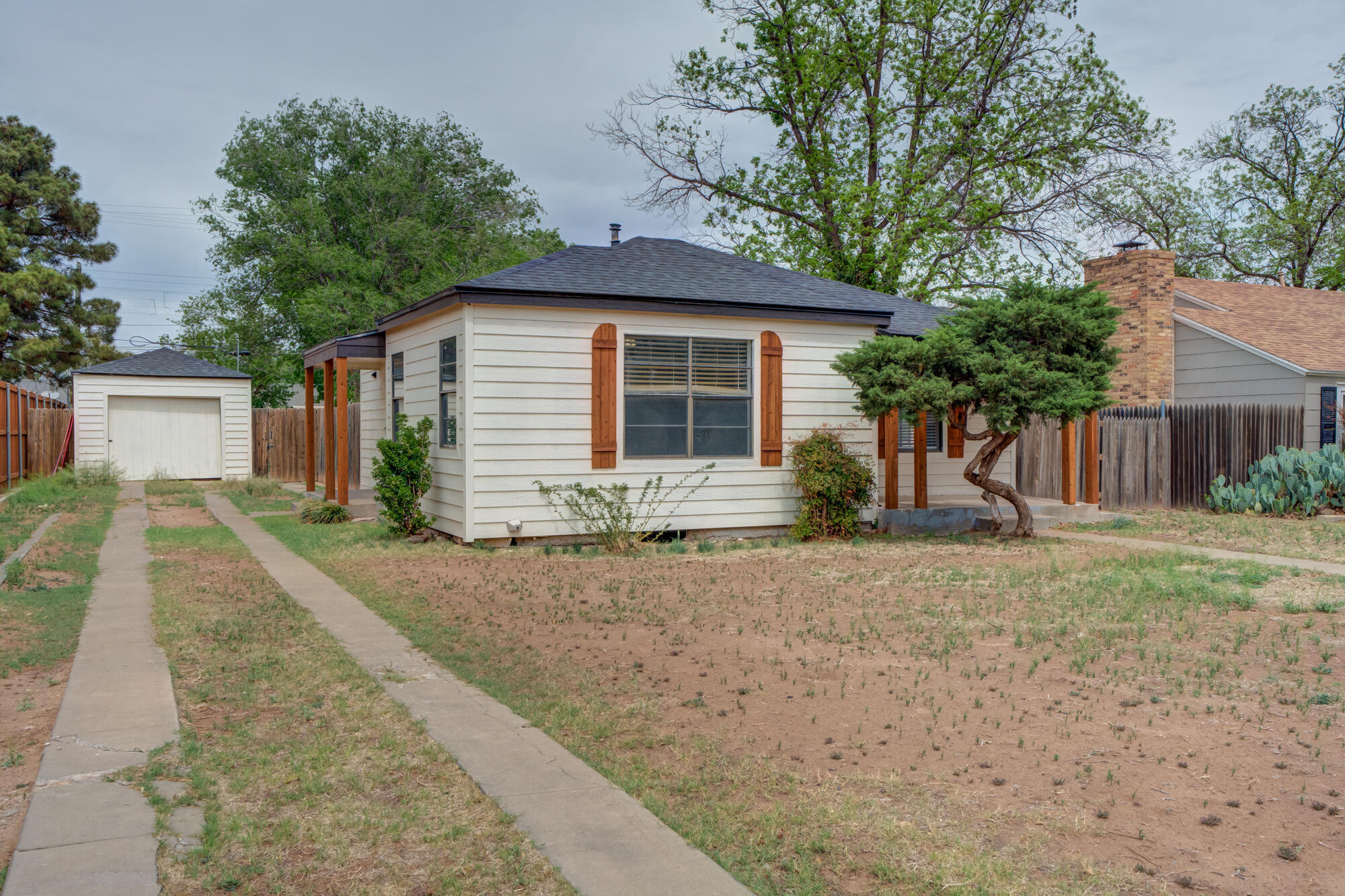 2308 30th Street Lubbock, TX 79411 - Photo 4 of 21 a front view of house with yard and trees