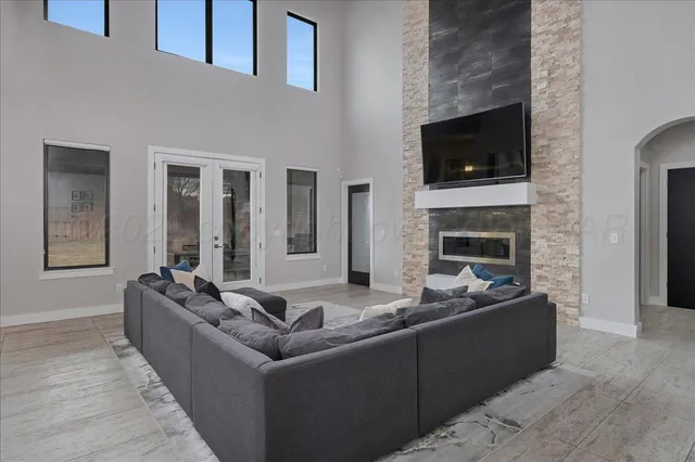 a kitchen with kitchen island stainless steel appliances a sink and a refrigerator