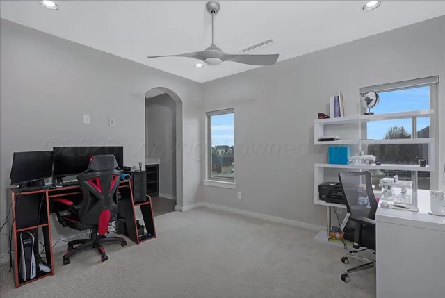 a kitchen with a refrigerator and cabinets