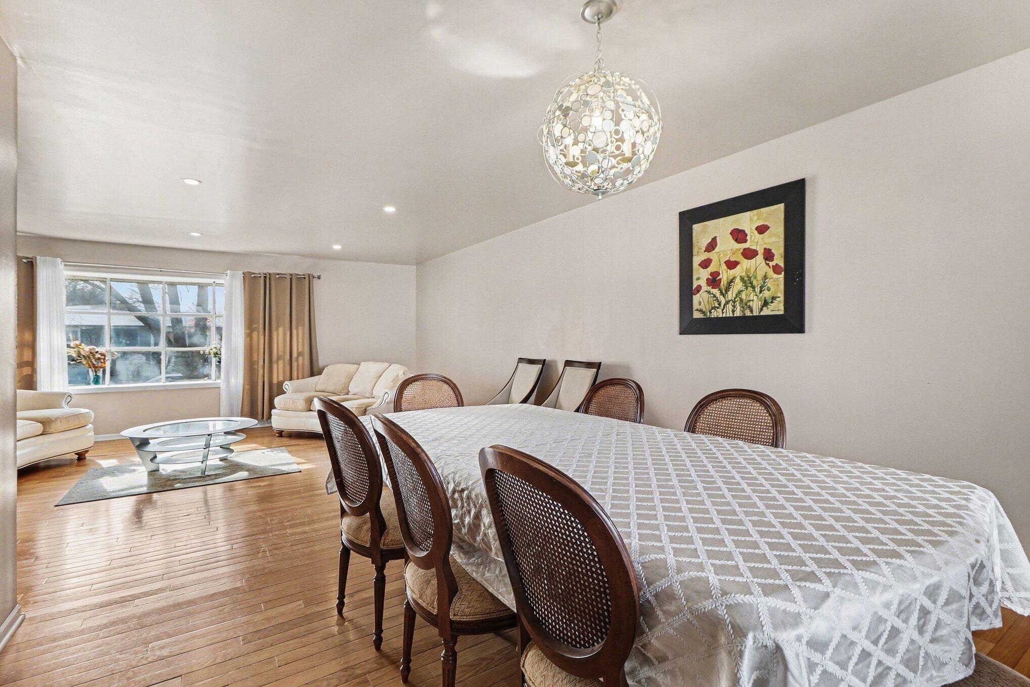 551 Union Place Gary, IN 46403 - Photo 11 of 28 a view of a dining room with furniture wooden floor and chandelier