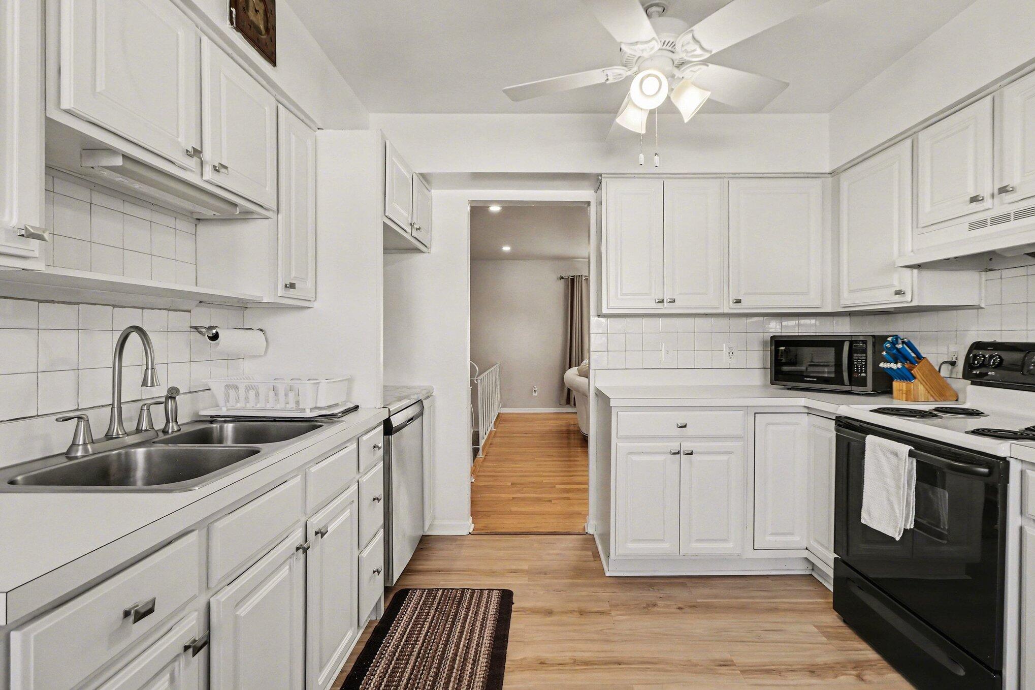 551 Union Place Gary, IN 46403 - Photo 13 of 28 a kitchen with stainless steel appliances granite countertop a sink and cabinets