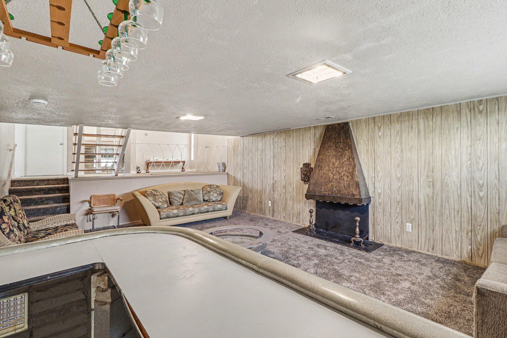 551 Union Place Gary, IN 46403 - Photo 16 of 28 a living room with a couch and a chandelier