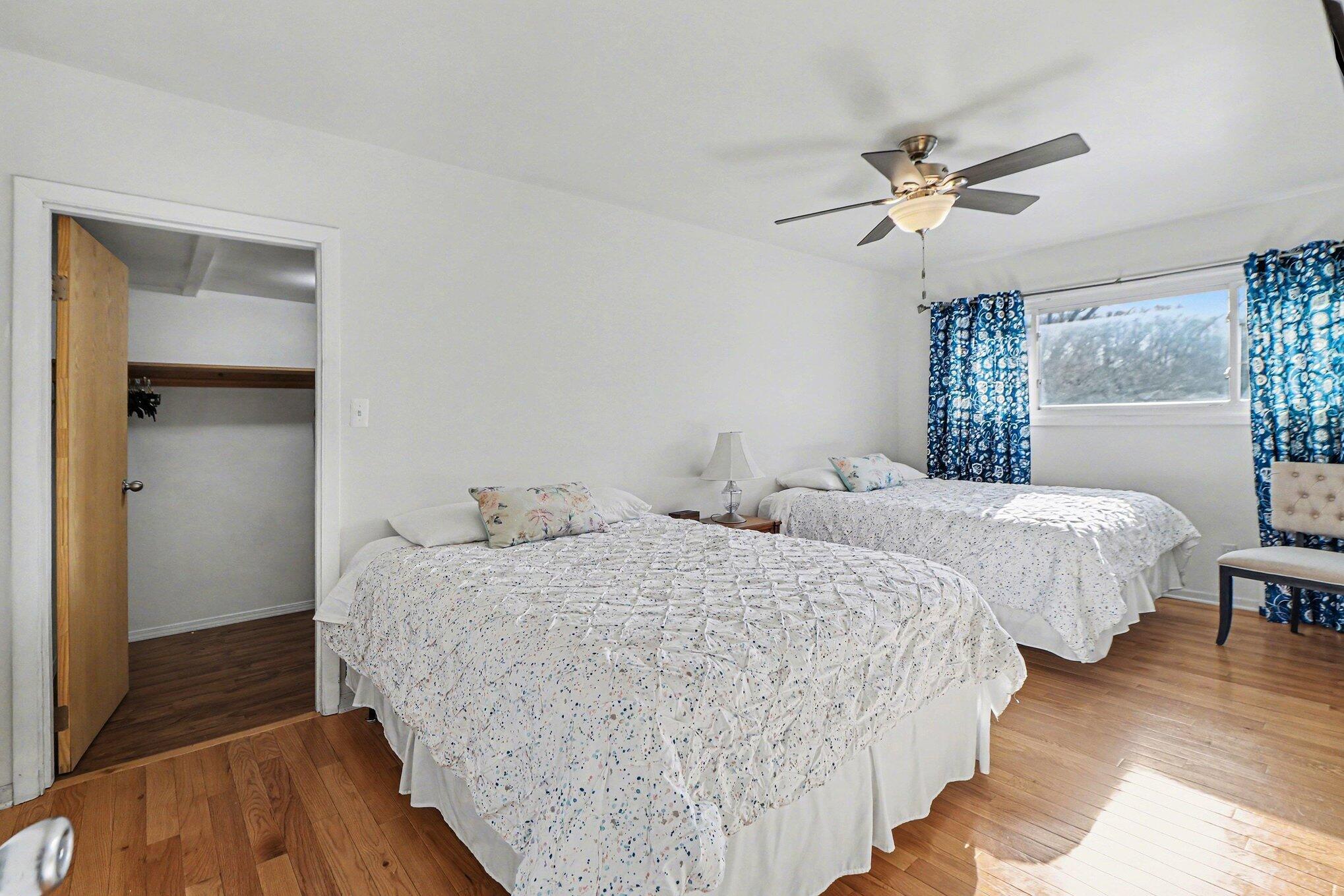 551 Union Place Gary, IN 46403 - Photo 19 of 28 a bedroom with two beds and a chandelier
