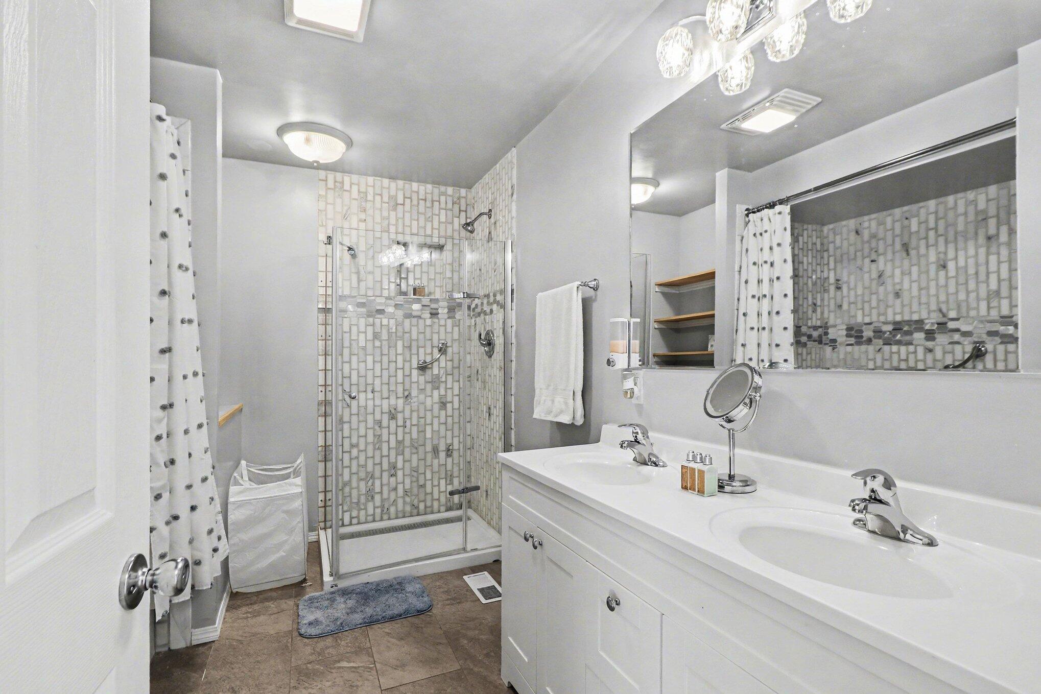 551 Union Place Gary, IN 46403 - Photo 21 of 28 a bathroom with a double vanity sink mirror and shower