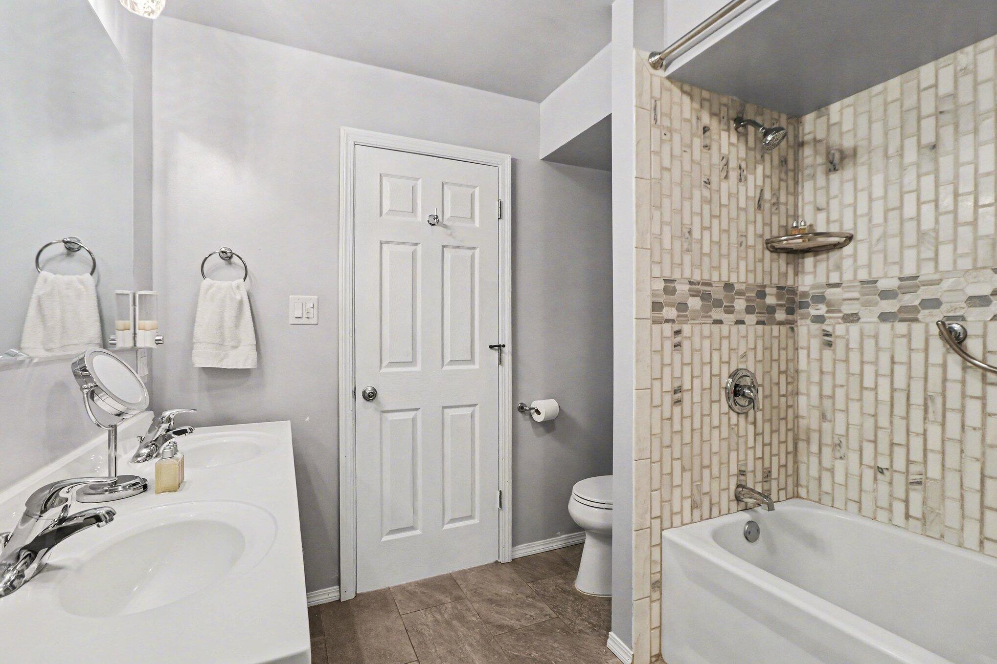 551 Union Place Gary, IN 46403 - Photo 23 of 28 a bathroom with a sink a toilet and shower