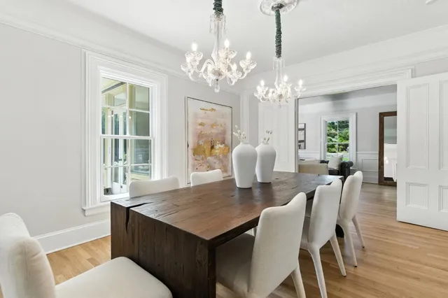 a kitchen with a dining table and chairs