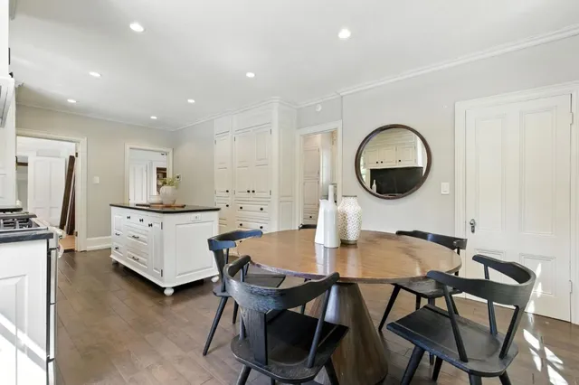 a bedroom with a bed and a table