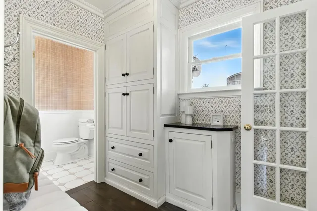 a bed room with a bed and a window