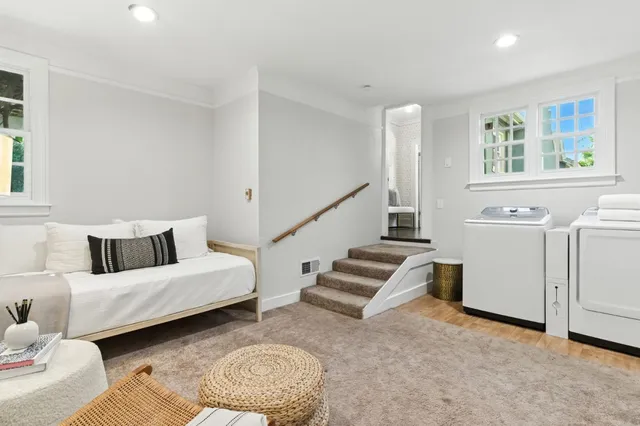 a bathroom with a shower curtain and a window