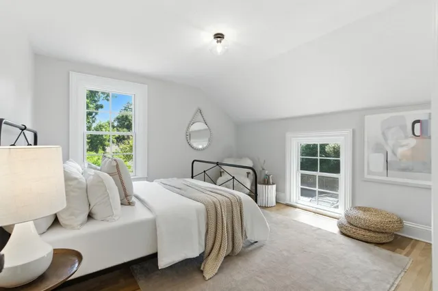 a view of a entrance gate of the house and trees