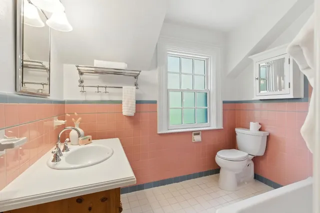 a living room with furniture a window and a table